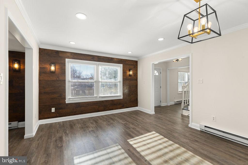 503 South Maple Court Sterling, VA 20164 - Photo 6 of 43 an empty room with wooden floor and windows