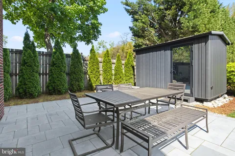 a view of swimming pool with outdoor seating and plants
