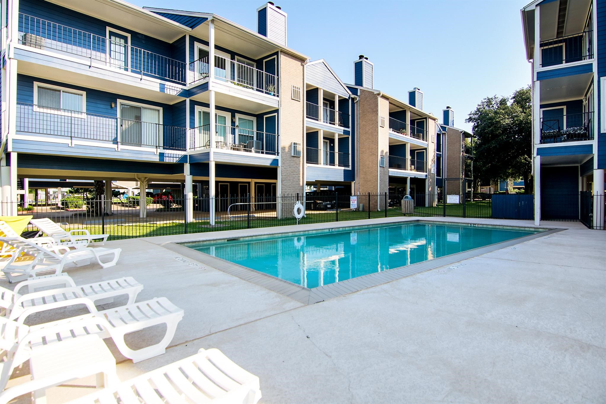18519 Egret Bay Boulevard, Unit 1704 Webster, TX 77058 - Photo 1 of 35 a view of pool with outdoor seating