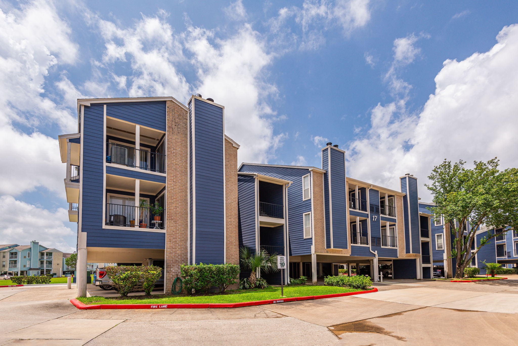 18519 Egret Bay Boulevard, Unit 1704 Webster, TX 77058 - Photo 15 of 35 a front view of a building with street view and trees