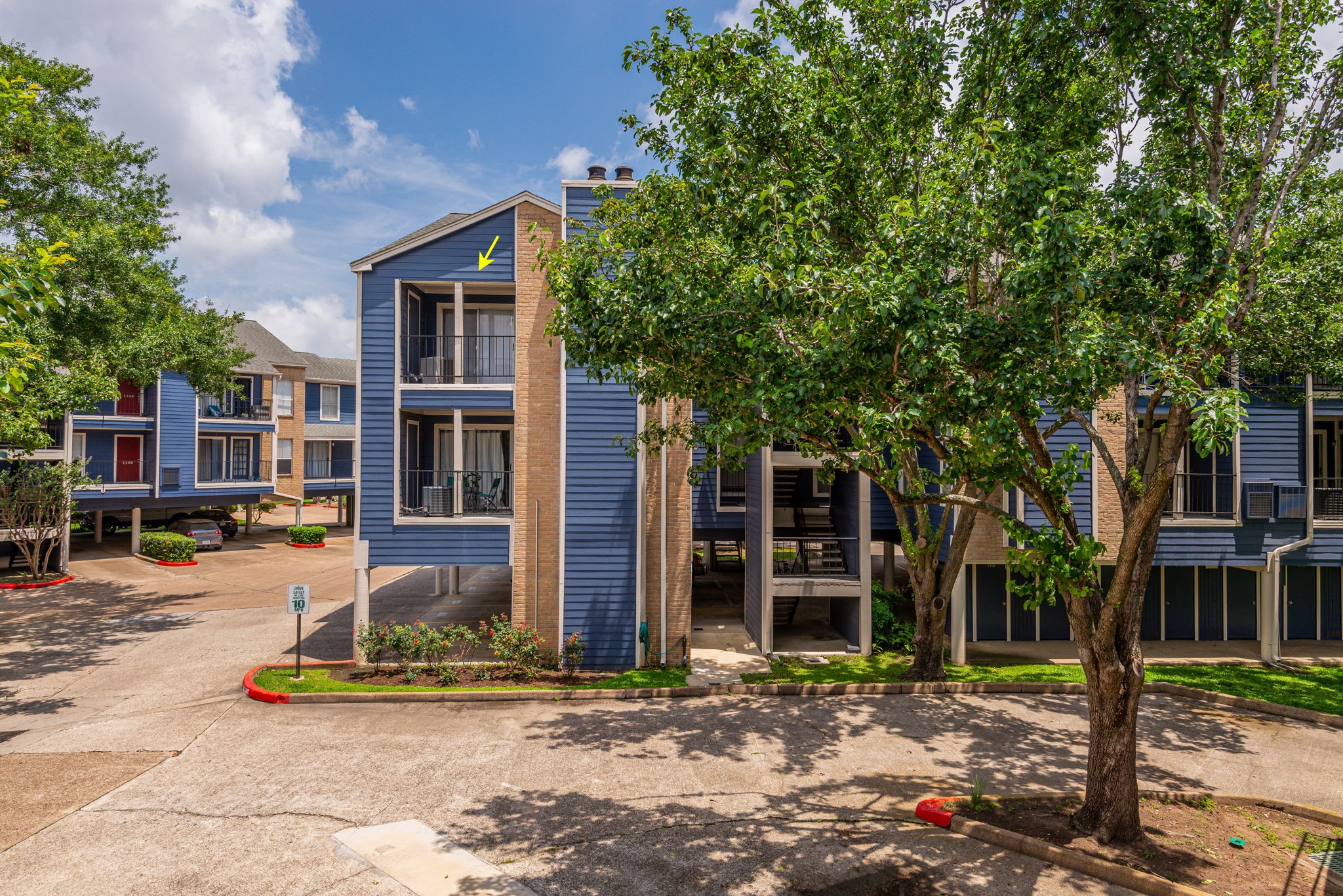 18519 Egret Bay Boulevard, Unit 1704 Webster, TX 77058 - Photo 18 of 35 a front view of a house with a tree