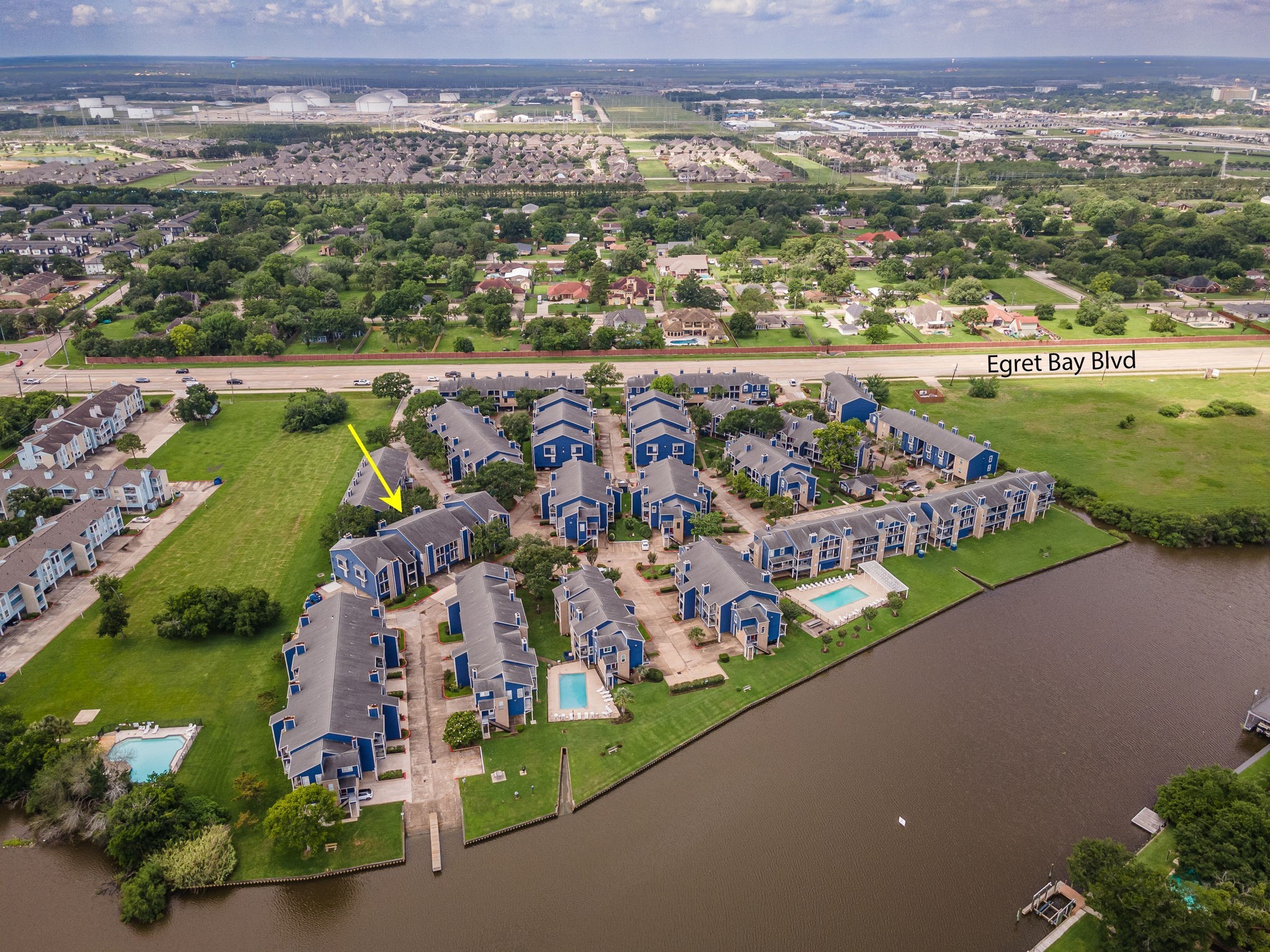 18519 Egret Bay Boulevard, Unit 1704 Webster, TX 77058 - Photo 25 of 35 an aerial view of a city with lots of residential buildings ocean and mountain view in back