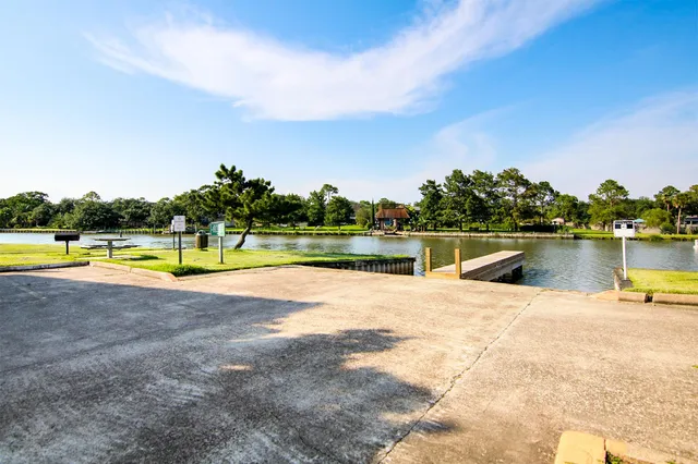 a view of a swimming pool and a yard