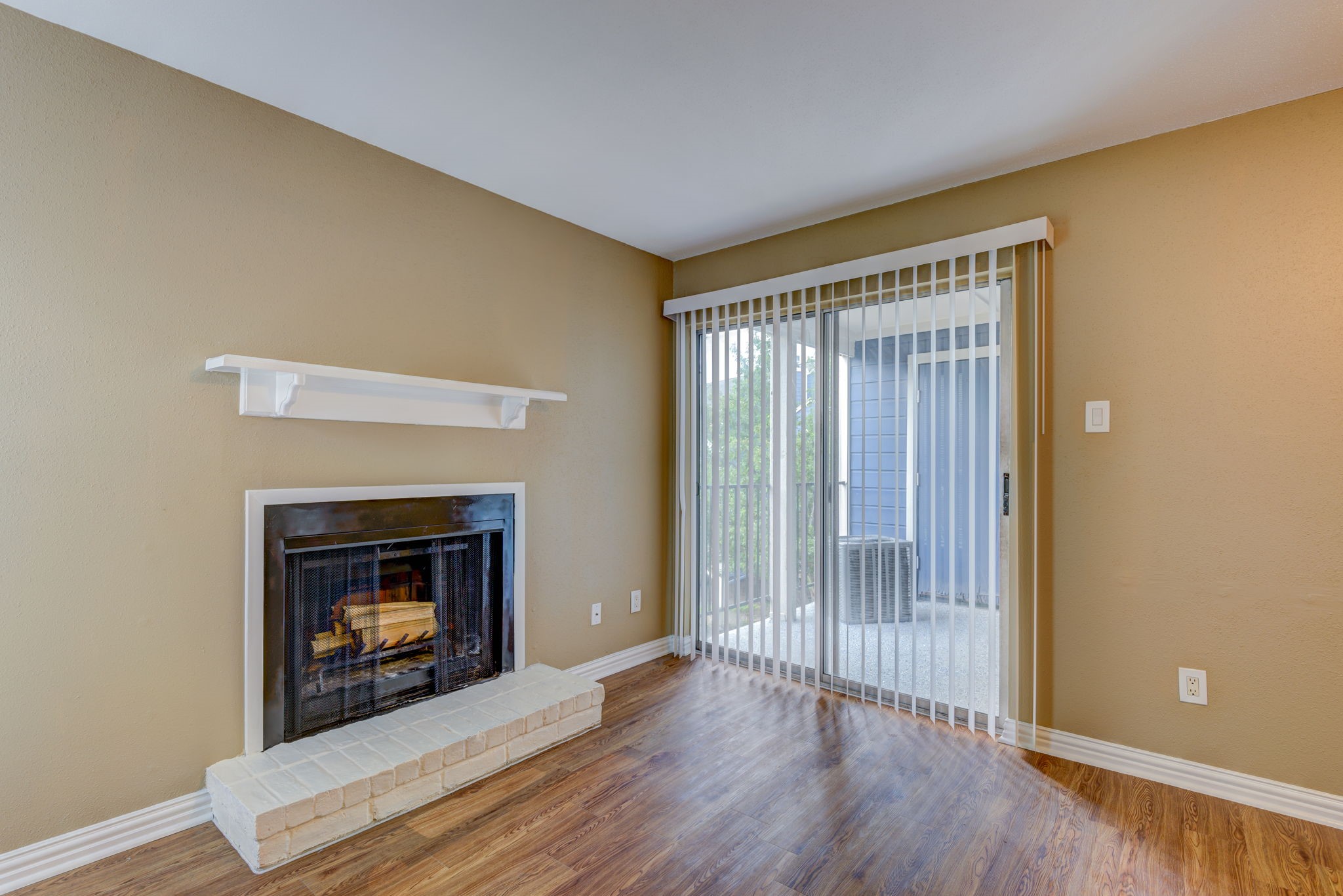 18519 Egret Bay Boulevard, Unit 1704 Webster, TX 77058 - Photo 5 of 35 a view of an empty room with wooden floor fireplace and a window