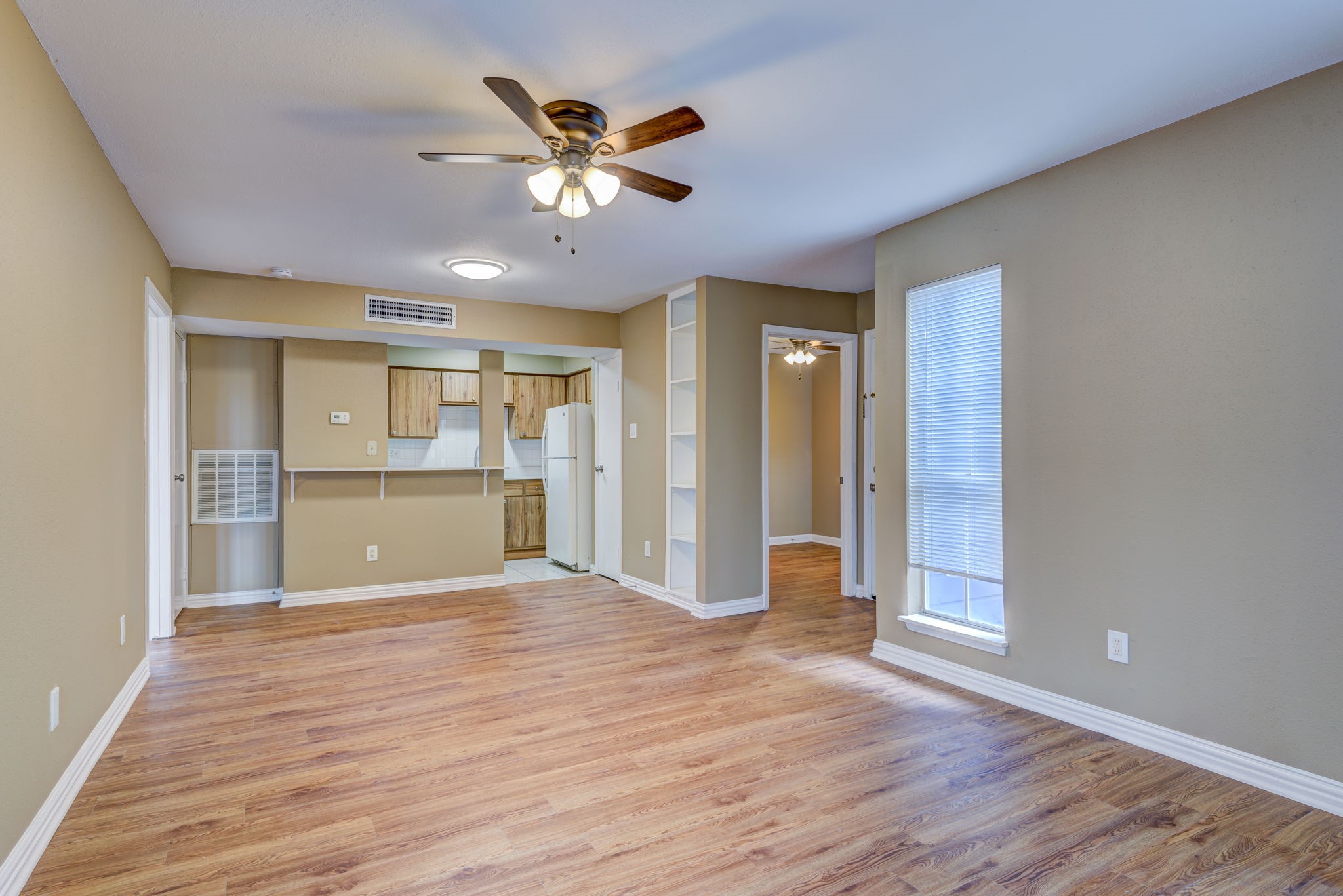 18519 Egret Bay Boulevard, Unit 1704 Webster, TX 77058 - Photo 6 of 35 a view of a kitchen with a dishwasher and wooden floor