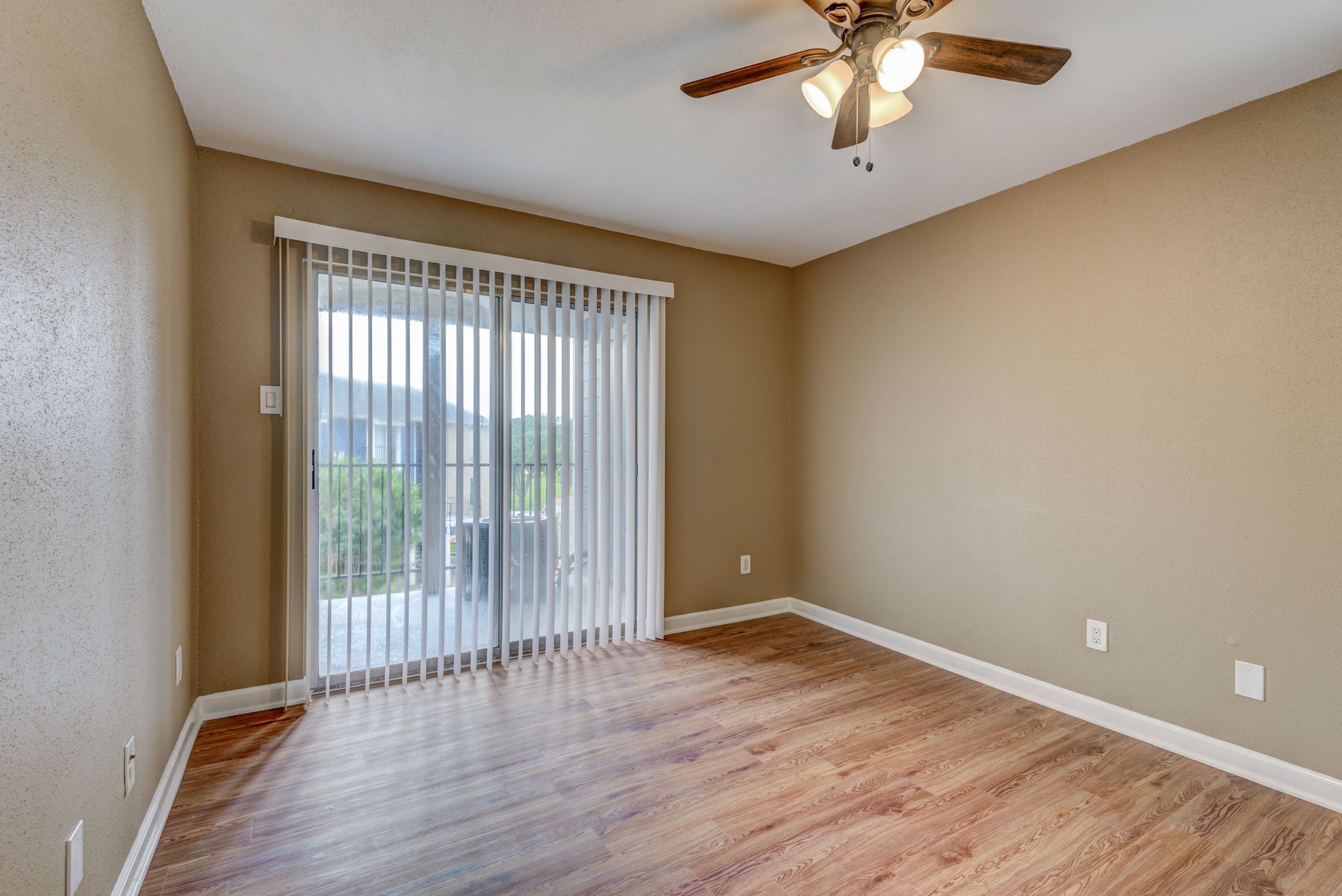 18519 Egret Bay Boulevard, Unit 1704 Webster, TX 77058 - Photo 10 of 35 wooden floor in an empty room with a window
