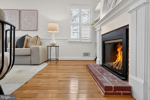 a view of a dining room with furniture wooden floor and a chandelier