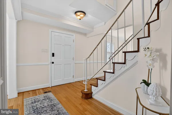 a living room with furniture a rug and a fireplace