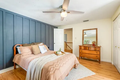 a bedroom with a bed and a view of bathroom