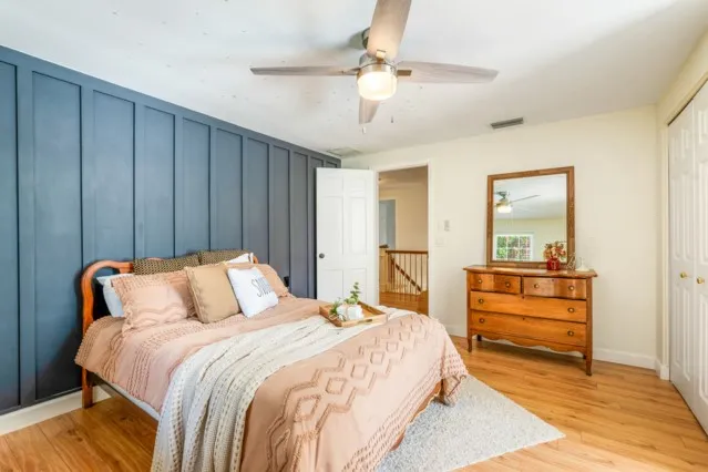 a bedroom with a bed and a view of bathroom