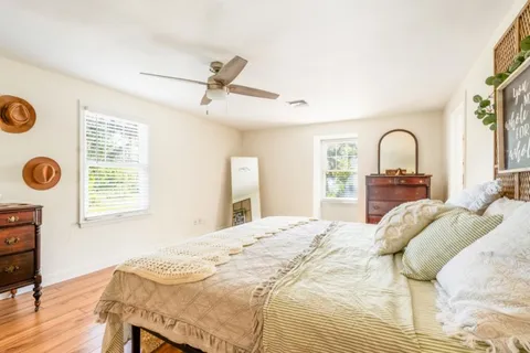 a bedroom with a bed and a dresser