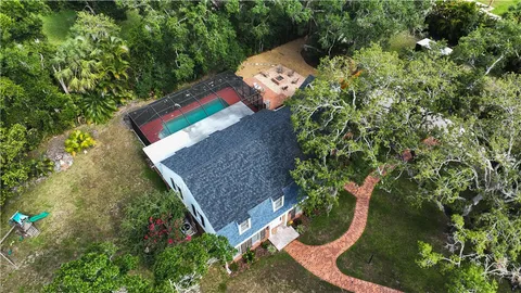 an aerial view of a house having yard