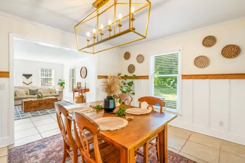a view of a dining table and chairs in the livingroom