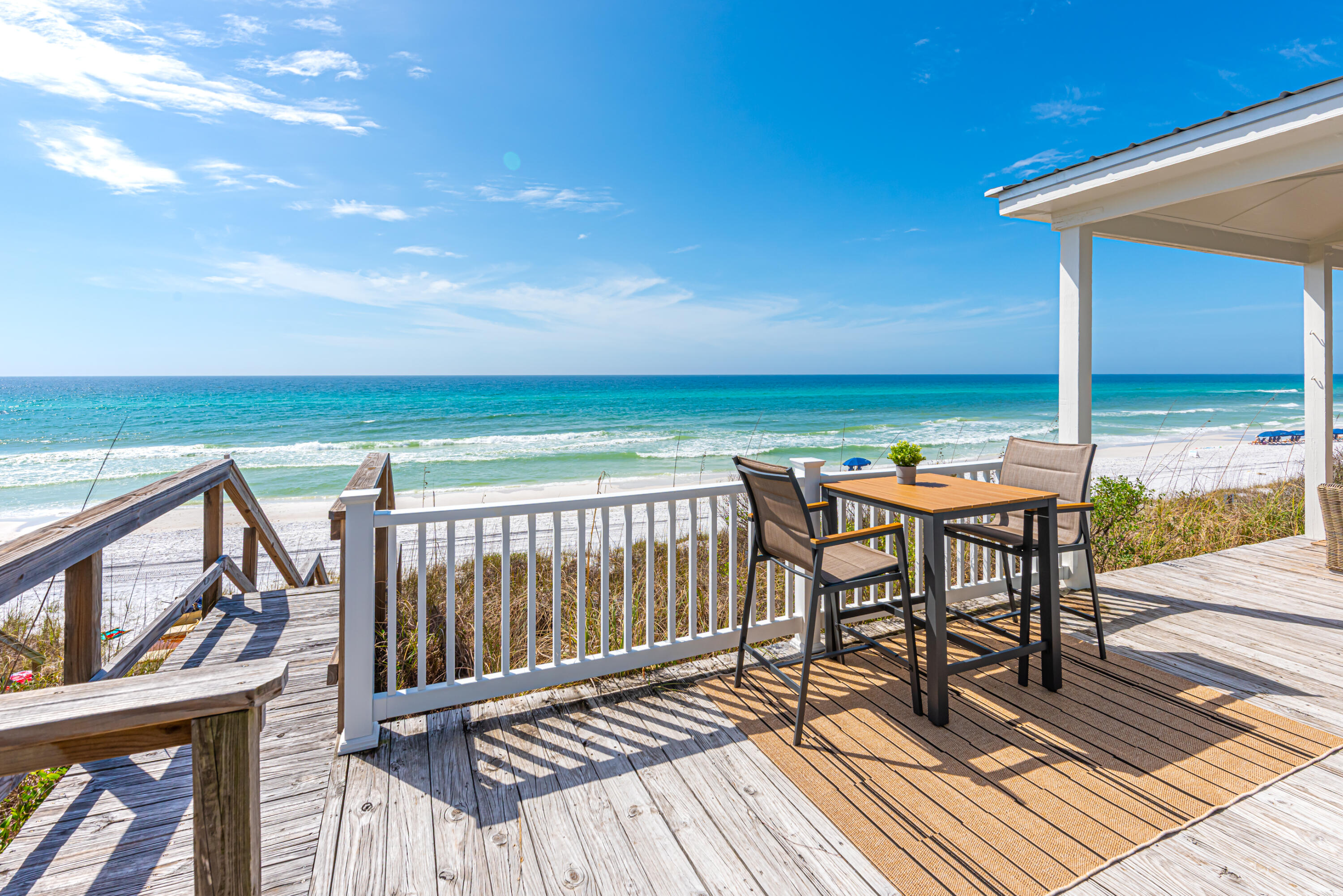4731 West County Highway 30A Santa Rosa Beach, FL 32459 - Photo 22 of 44 a view of balcony with wooden floor and outdoor seating