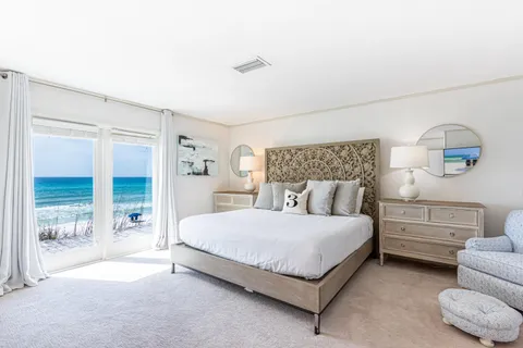 a spacious bedroom with a bed and walk in closet