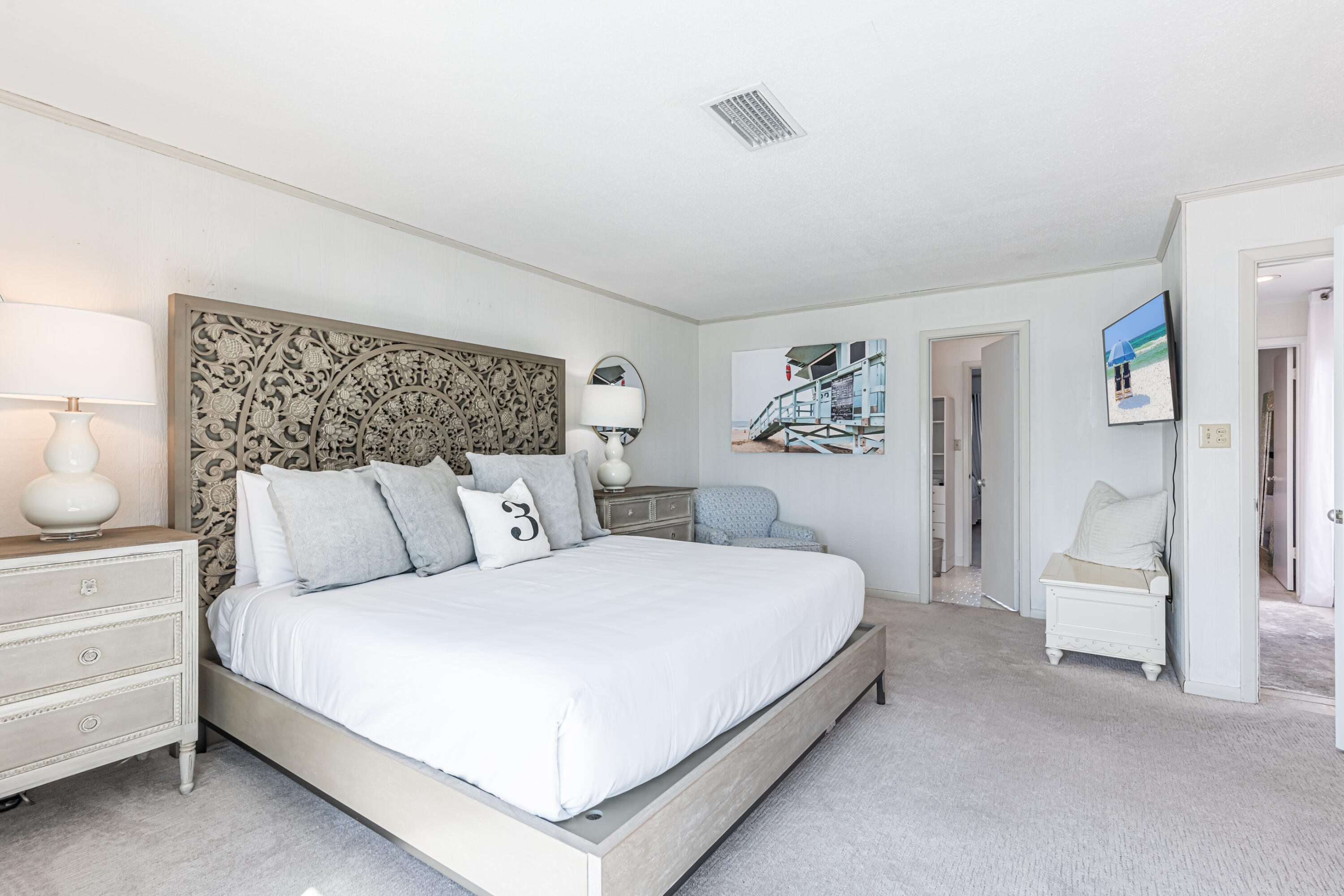 4731 West County Highway 30A Santa Rosa Beach, FL 32459 - Photo 25 of 44 a bedroom with a large bed and a couch