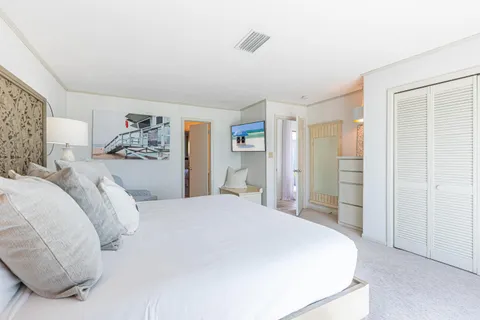 a bathroom with a walk in closet