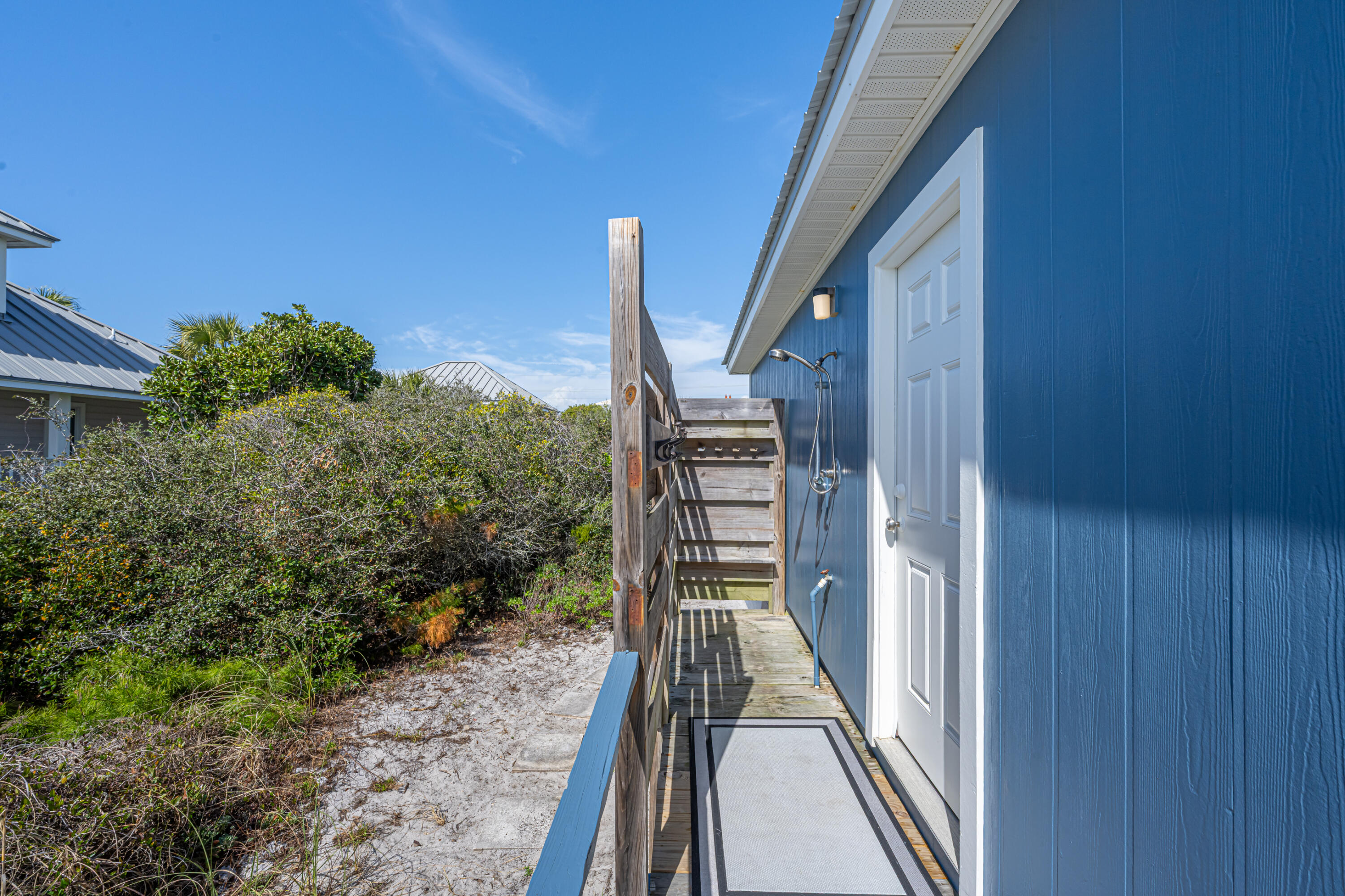 4731 West County Highway 30A Santa Rosa Beach, FL 32459 - Photo 30 of 44 a view of balcony with wooden floor and fence