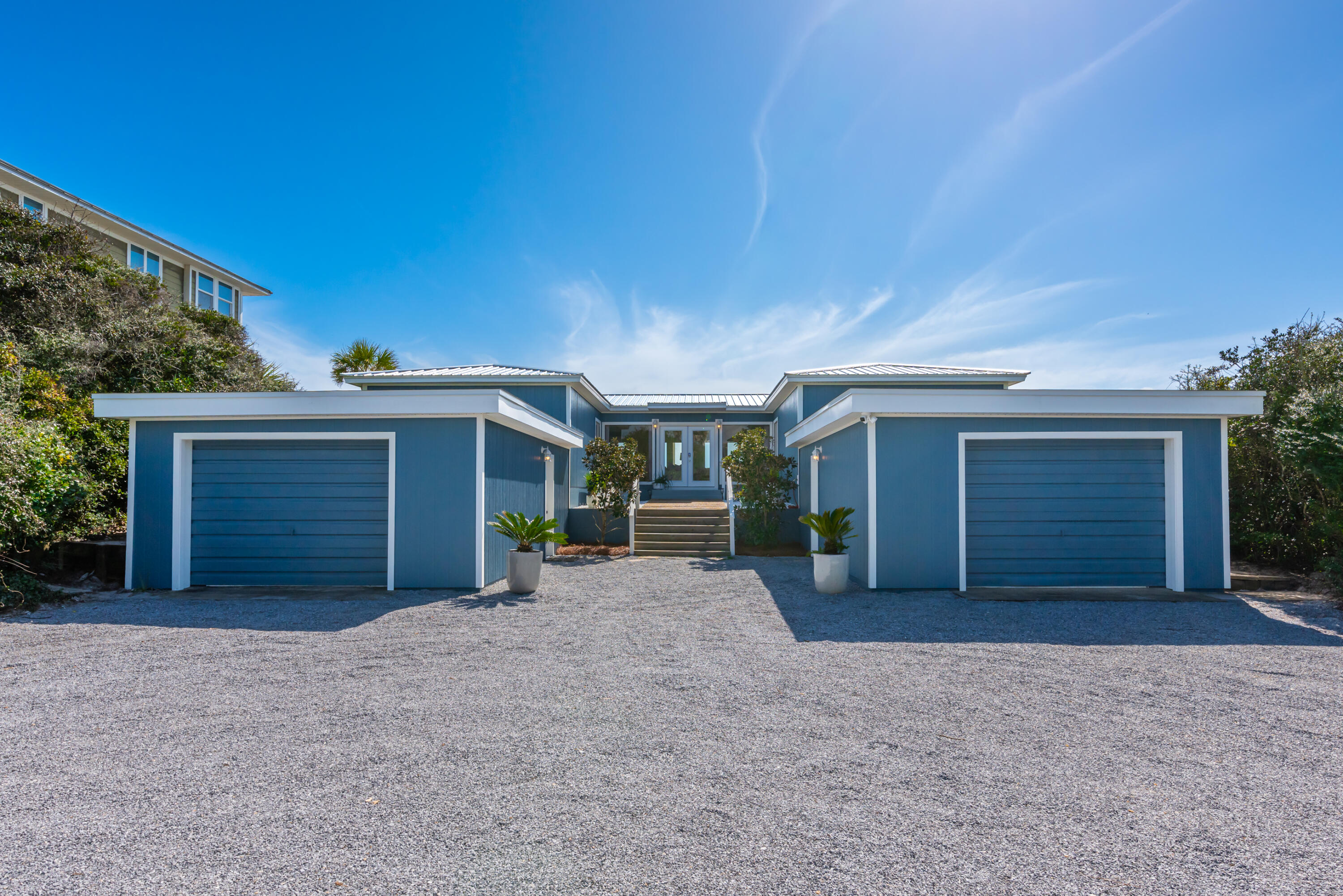 4731 West County Highway 30A Santa Rosa Beach, FL 32459 - Photo 3 of 44 a view of a house with a yard and garage