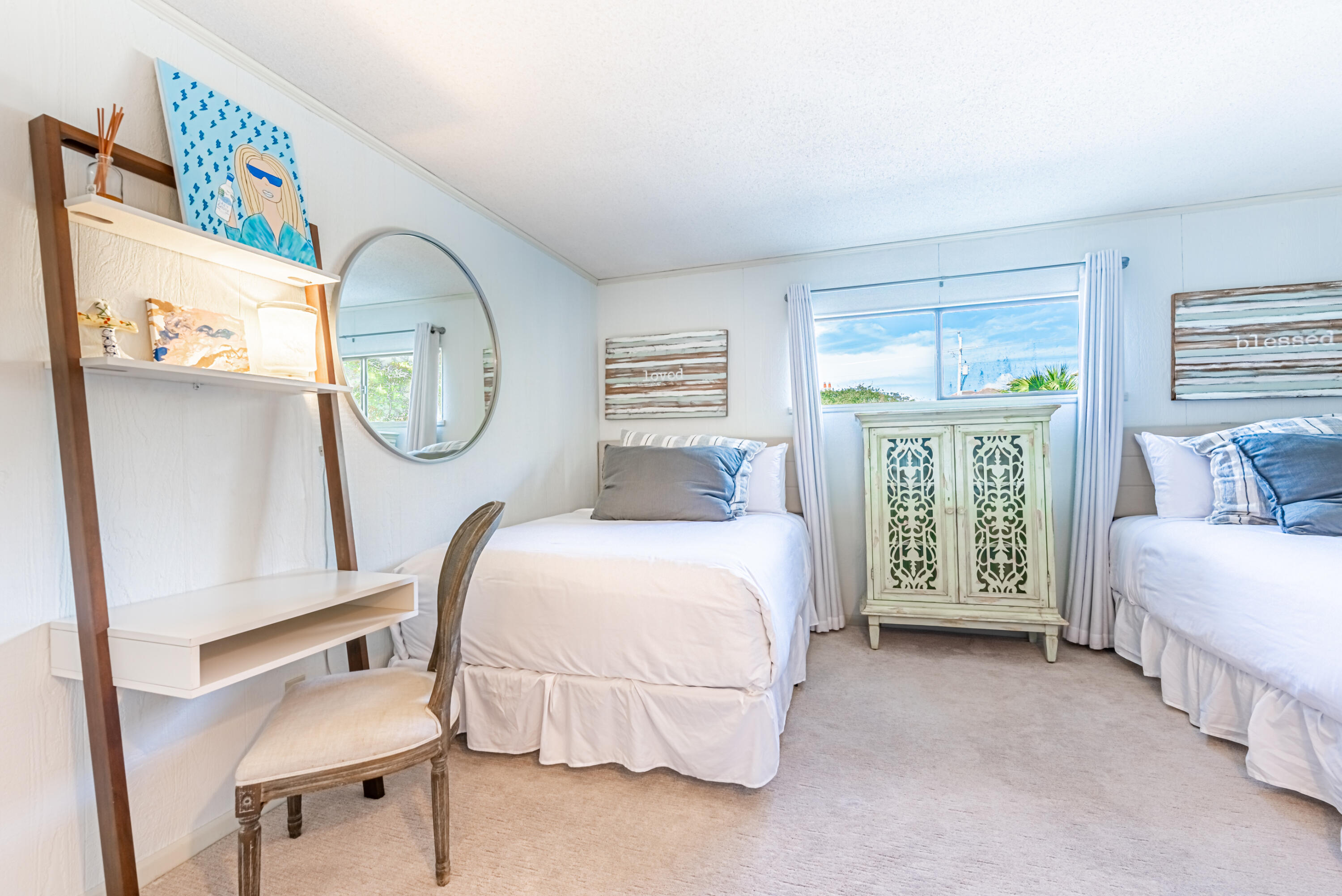 4731 West County Highway 30A Santa Rosa Beach, FL 32459 - Photo 36 of 44 a spacious bedroom with a bed a mirror and a window