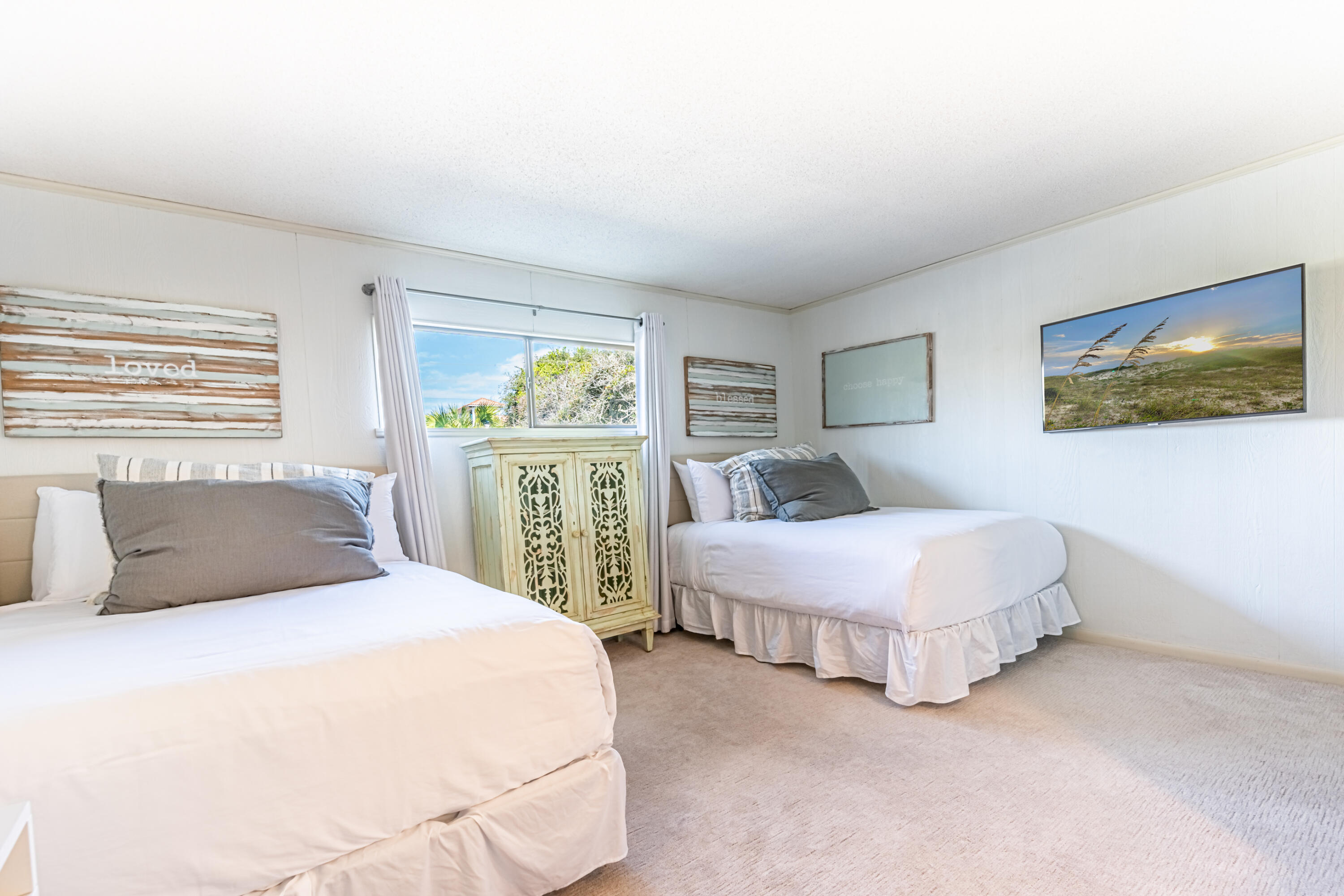 4731 West County Highway 30A Santa Rosa Beach, FL 32459 - Photo 37 of 44 a bedroom with two beds and a large window