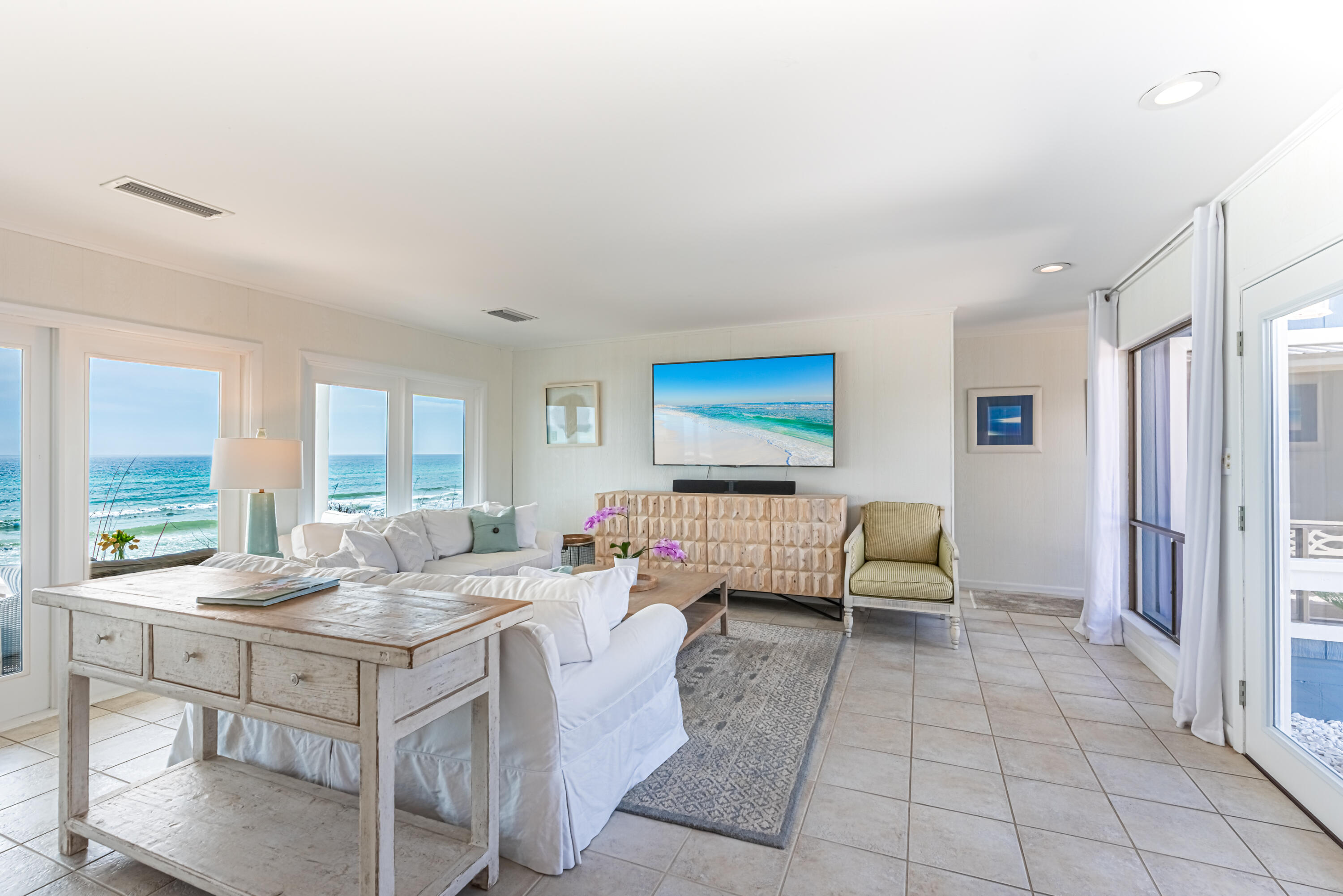 4731 West County Highway 30A Santa Rosa Beach, FL 32459 - Photo 7 of 44 a living room with furniture and a table