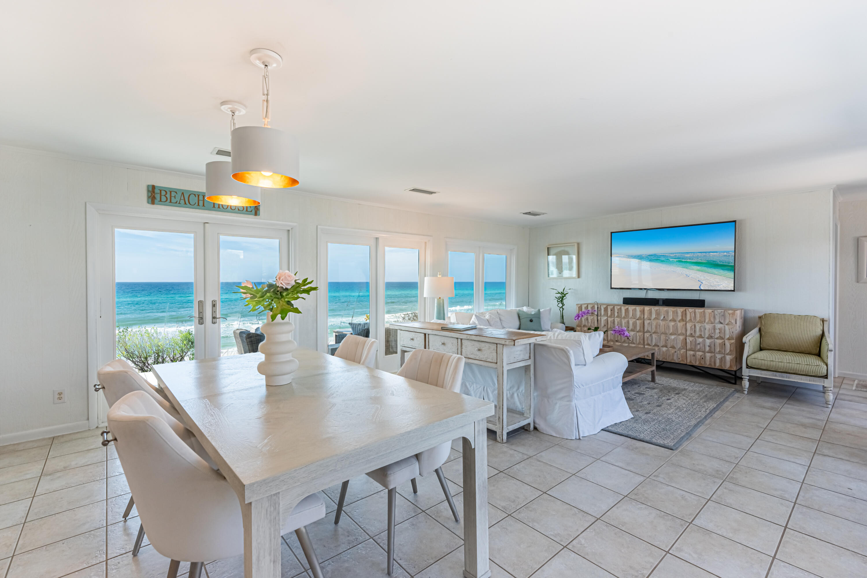 4731 West County Highway 30A Santa Rosa Beach, FL 32459 - Photo 10 of 44 a living room with furniture and a flat screen tv