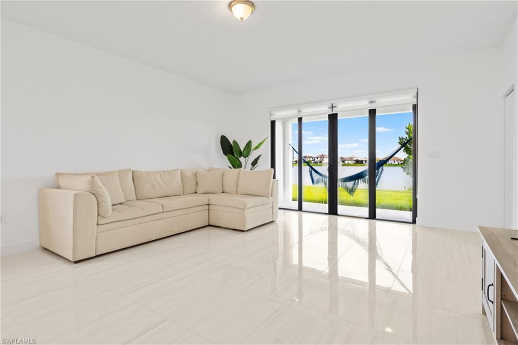 4951 Brigata Way Avenue Immokalee, FL 34142 - Photo 11 of 49 a living room with furniture and a large window