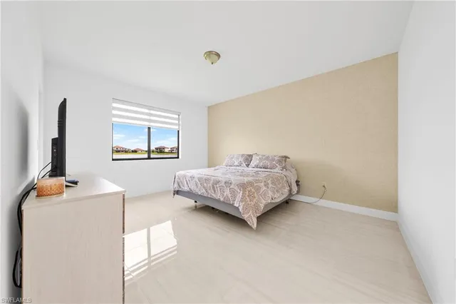 a view of a dining room with a table and chairs