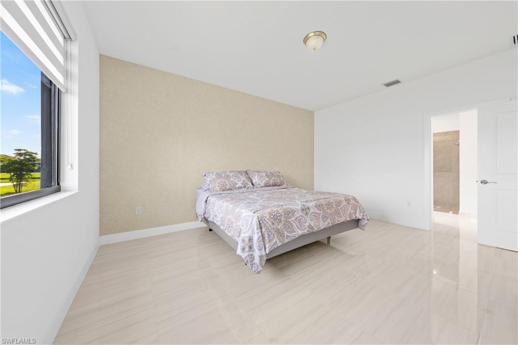 4951 Brigata Way Avenue Immokalee, FL 34142 - Photo 15 of 49 a bedroom with a bed and a window