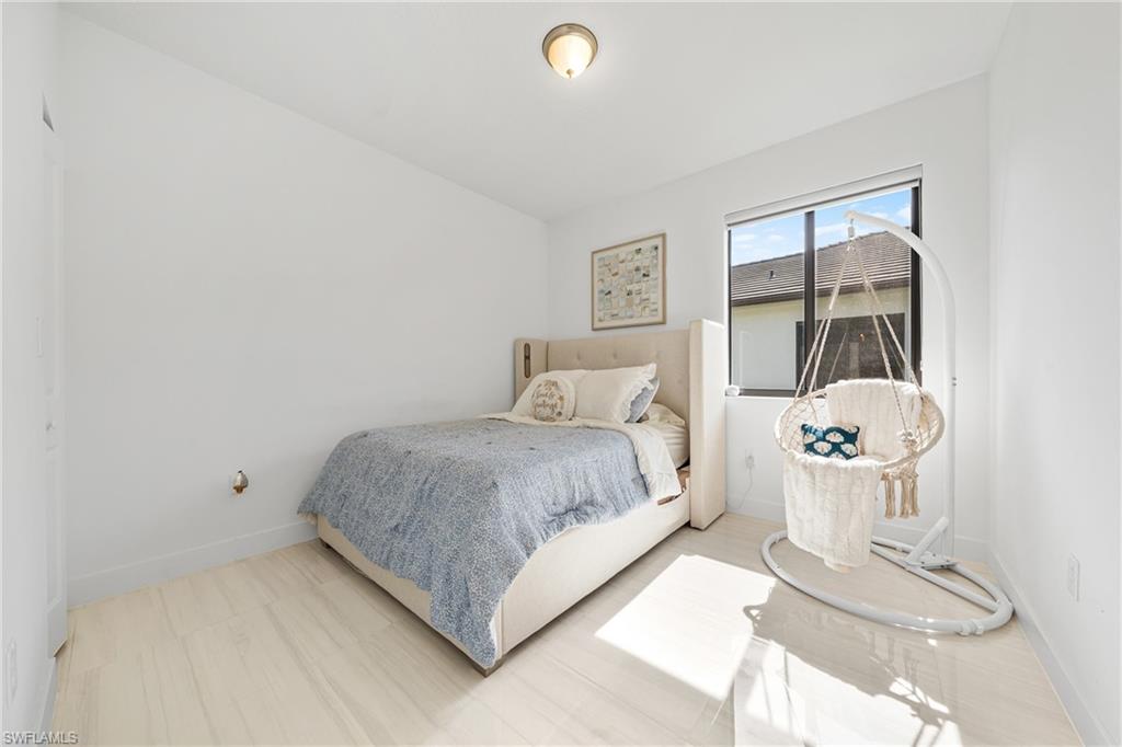 4951 Brigata Way Avenue Immokalee, FL 34142 - Photo 19 of 49 a bedroom with a bed and painting on the wall