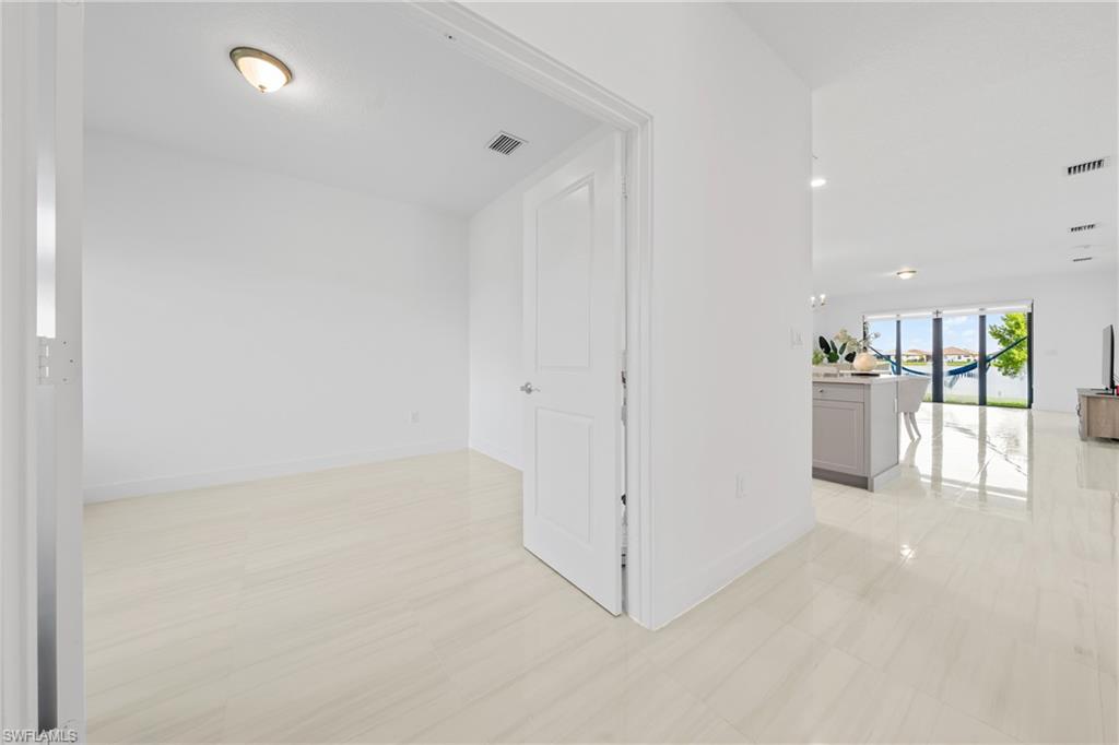 4951 Brigata Way Avenue Immokalee, FL 34142 - Photo 25 of 49 a view of a kitchen with a refrigerator and a sink