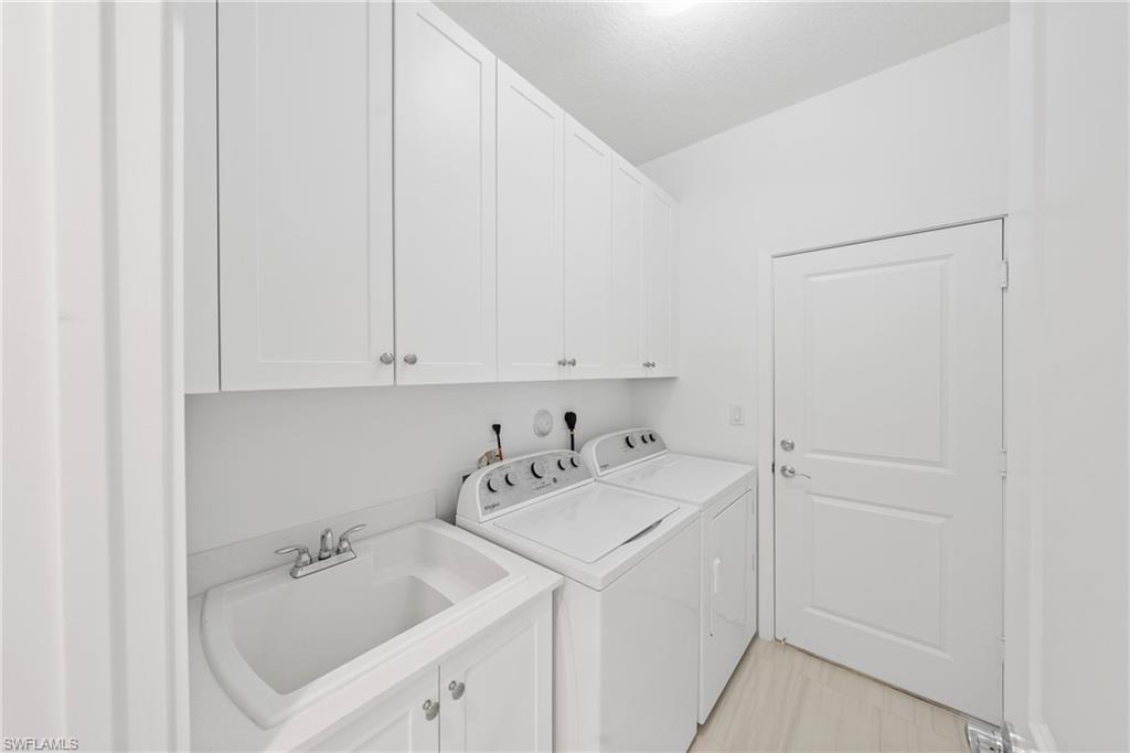 4951 Brigata Way Avenue Immokalee, FL 34142 - Photo 29 of 49 a utility room with a sink