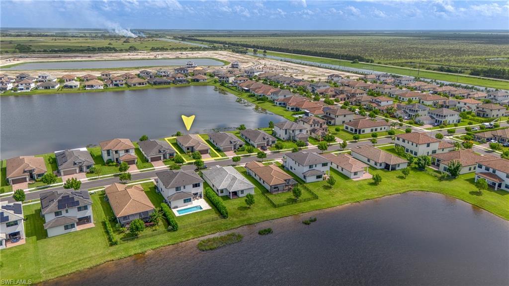 4951 Brigata Way Avenue Immokalee, FL 34142 - Photo 33 of 49 an aerial view of a city and lake view
