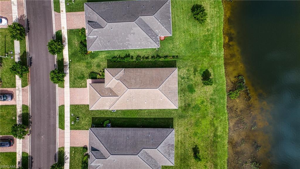 4951 Brigata Way Avenue Immokalee, FL 34142 - Photo 36 of 49 an aerial view of a house with a garden and plants