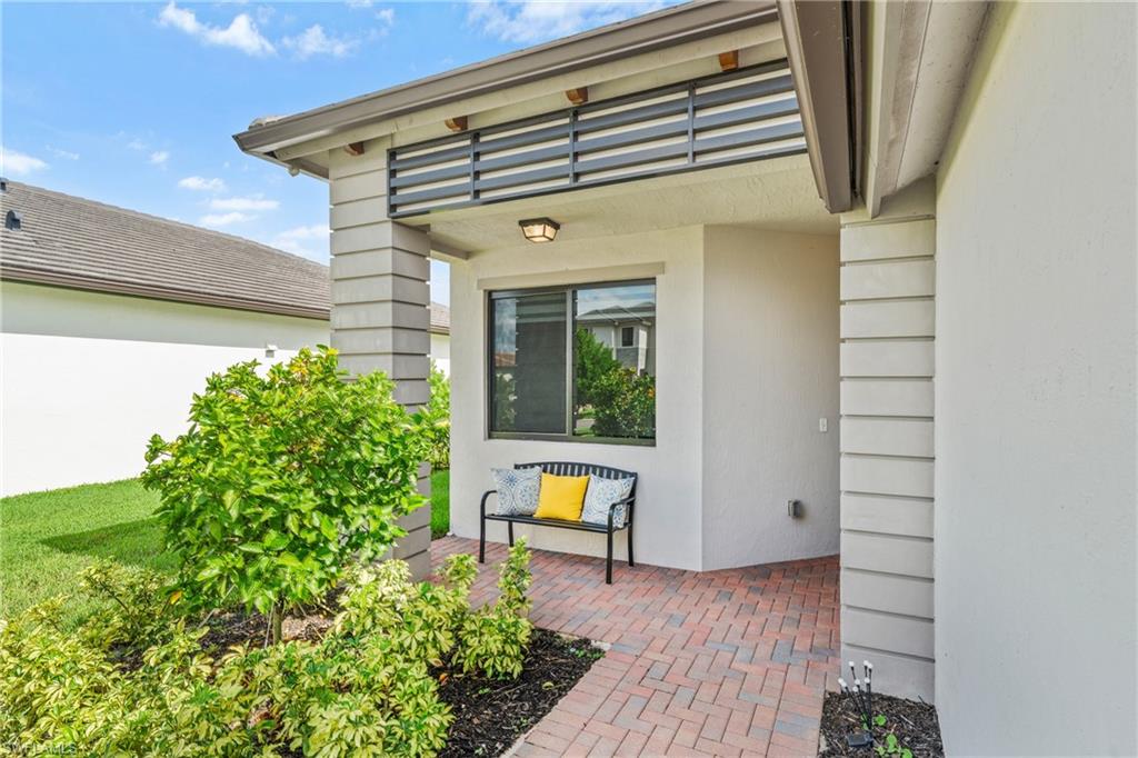 4951 Brigata Way Avenue Immokalee, FL 34142 - Photo 4 of 49 a front view of a house with a yard