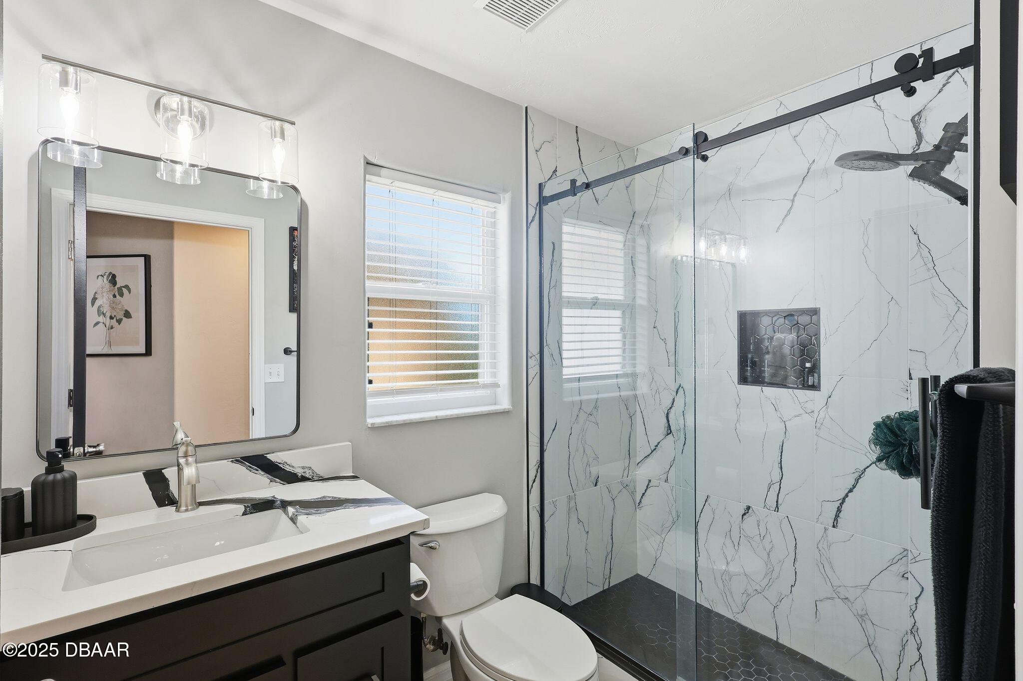 6127 Sabal Point Circle Port Orange, FL 32128 - Photo 27 of 53 a bathroom with a sink toilet tub and shower