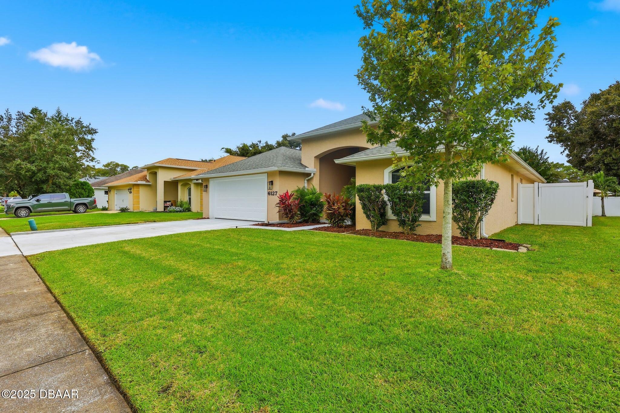 6127 Sabal Point Circle Port Orange, FL 32128 - Photo 39 of 53 a front view of a house with a yard