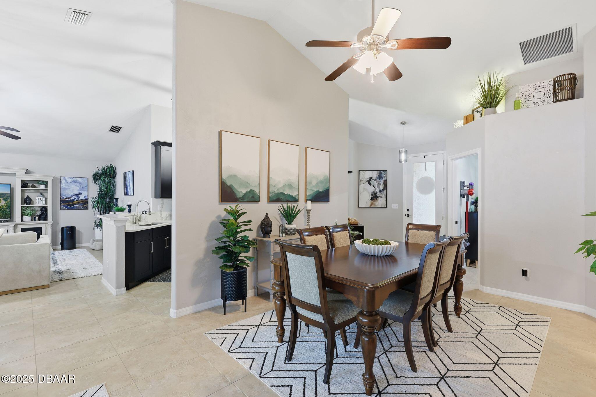 6127 Sabal Point Circle Port Orange, FL 32128 - Photo 7 of 53 a view of a dining room with furniture and chandelier