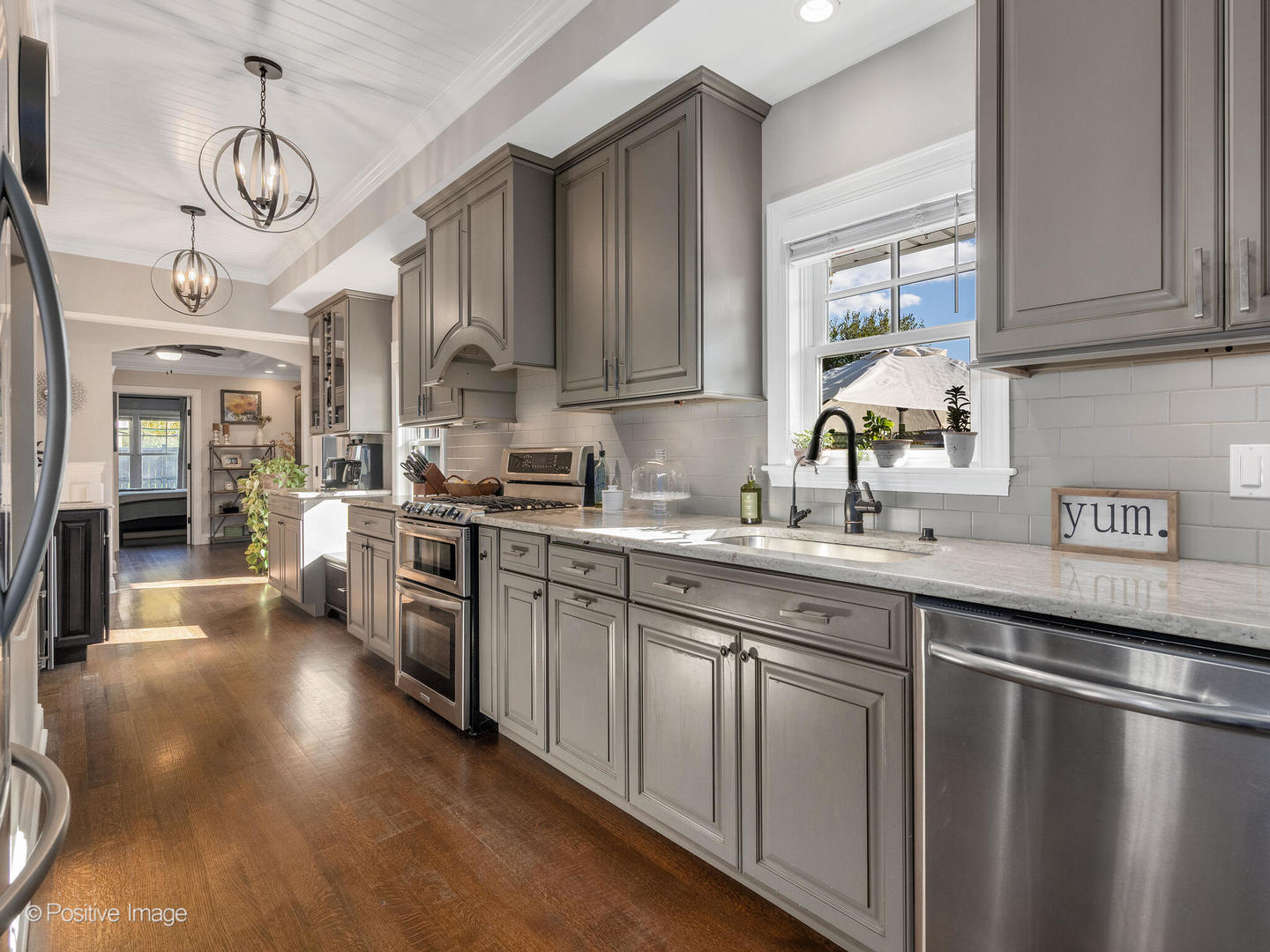 448 West Vallette Street Elmhurst, IL 60126 - Photo 12 of 30 a kitchen with stainless steel appliances granite countertop a sink a stove and cabinets