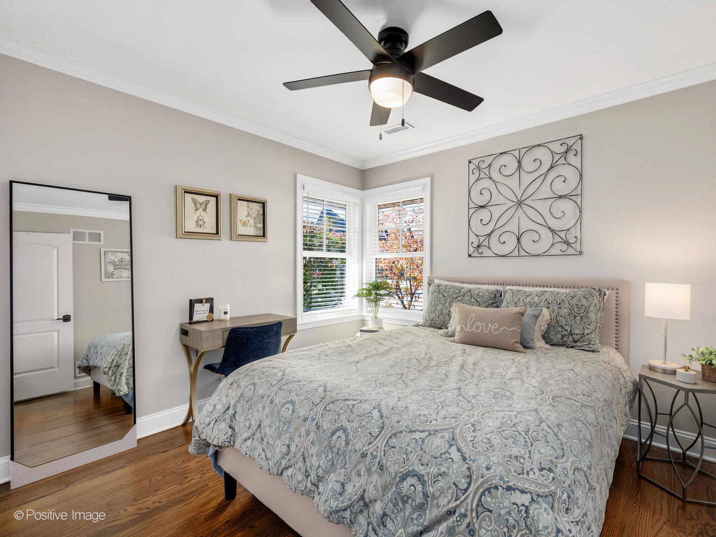 448 West Vallette Street Elmhurst, IL 60126 - Photo 21 of 30 a bedroom with a large bed and a chandelier