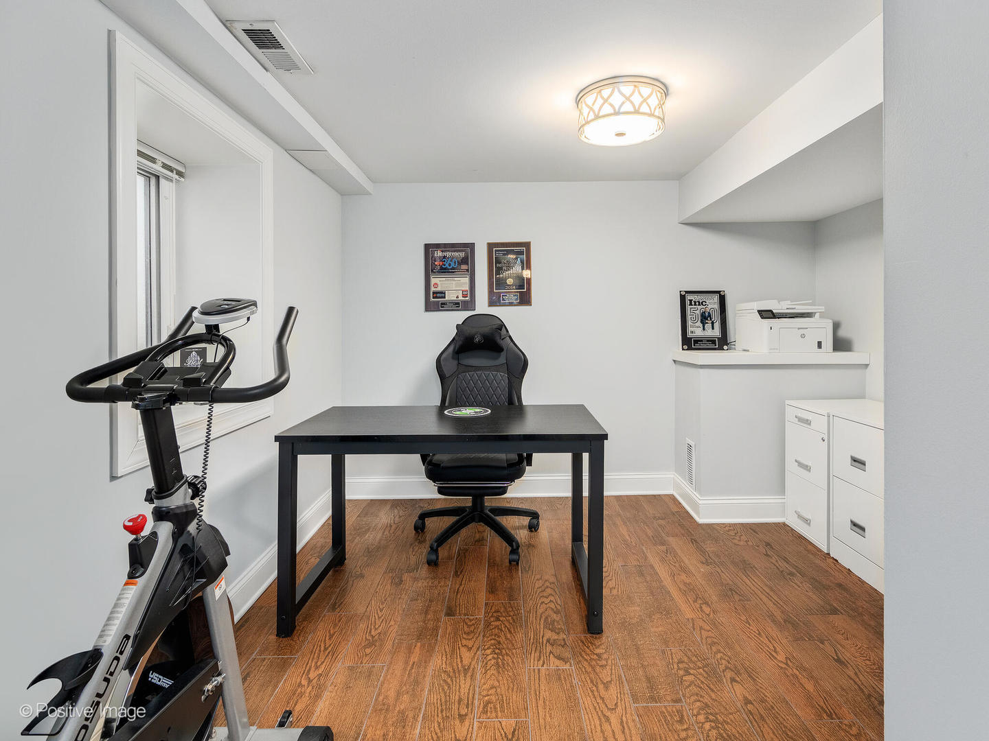 448 West Vallette Street Elmhurst, IL 60126 - Photo 23 of 30 a view of a workspace with furniture and wooden floor