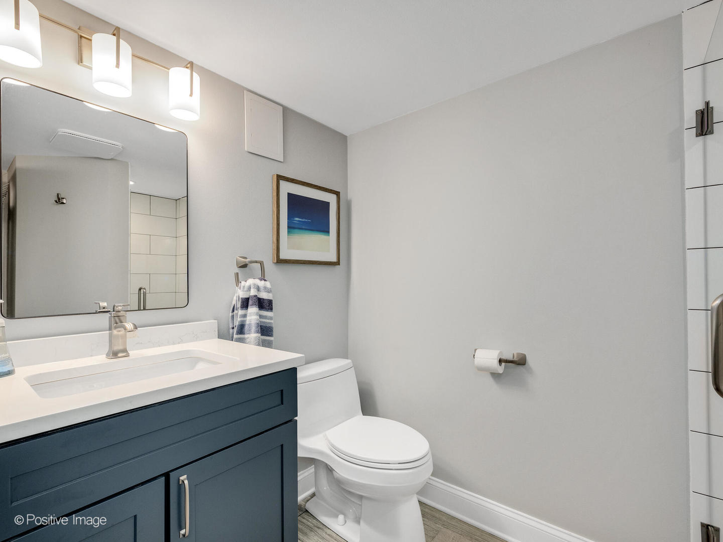 448 West Vallette Street Elmhurst, IL 60126 - Photo 24 of 30 a bathroom with a sink mirror vanity and toilet