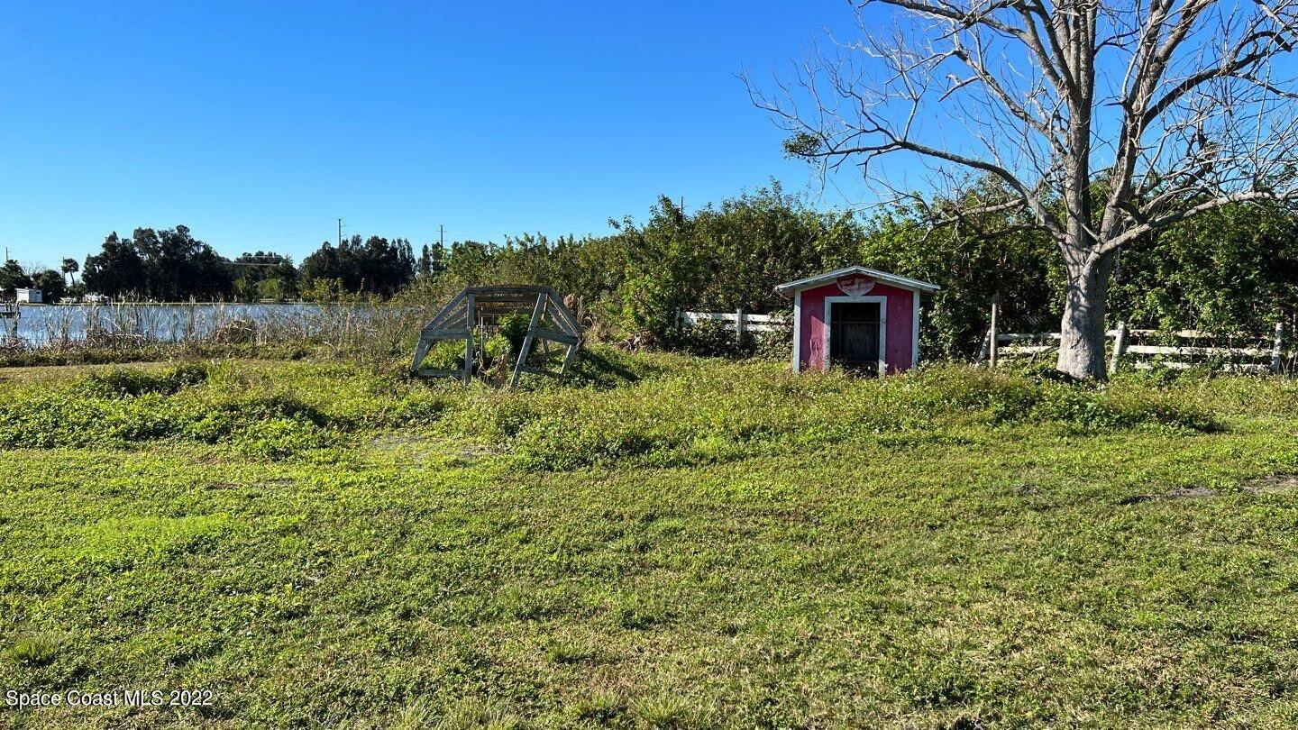 1455 Martin Road Rockledge, FL 32955 - Photo 8 of 18 a view of a house with a yard
