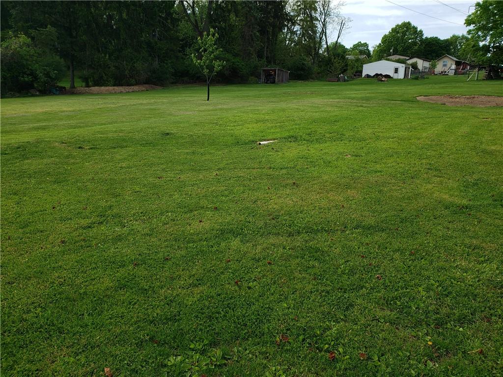 13861 Ridge Road North Huntingdon, PA 15642 - Photo 18 of 20 a view of a grassy field with trees
