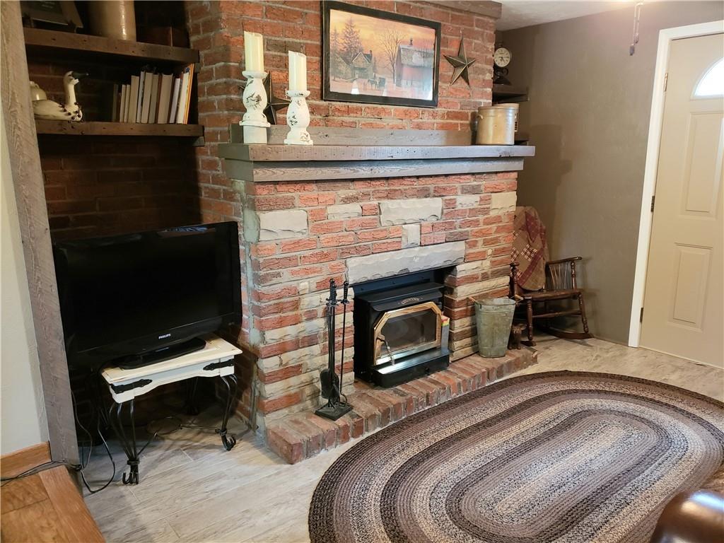 13861 Ridge Road North Huntingdon, PA 15642 - Photo 5 of 20 a bedroom with a bed and a fireplace