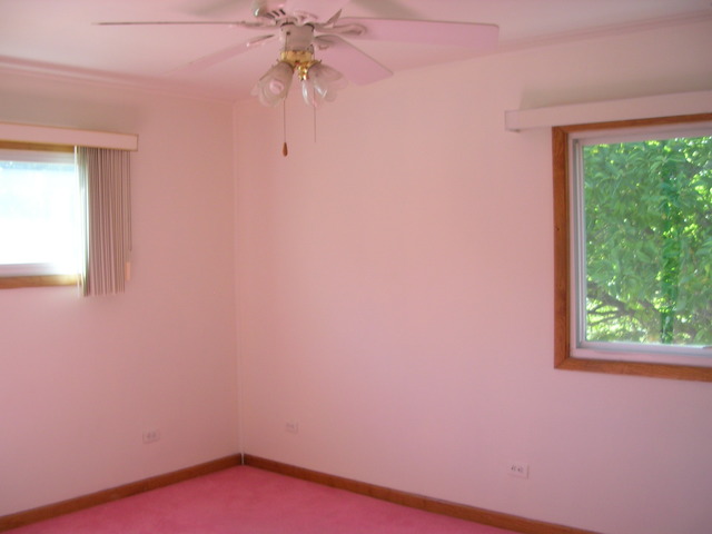 607 Elmhurst Road Mount Prospect, IL 60056 - Photo 11 of 24 a view of a small space with a window and a fan
