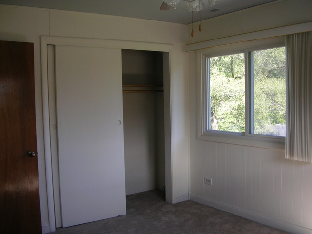 607 Elmhurst Road Mount Prospect, IL 60056 - Photo 12 of 24 a view of an empty room with a window