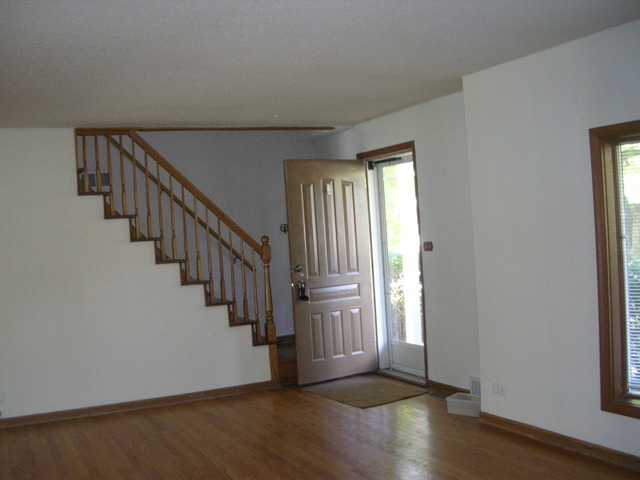 607 Elmhurst Road Mount Prospect, IL 60056 - Photo 2 of 24 a view of entryway with wooden floor