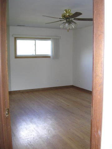607 Elmhurst Road Mount Prospect, IL 60056 - Photo 22 of 24 a view of an empty room and a window